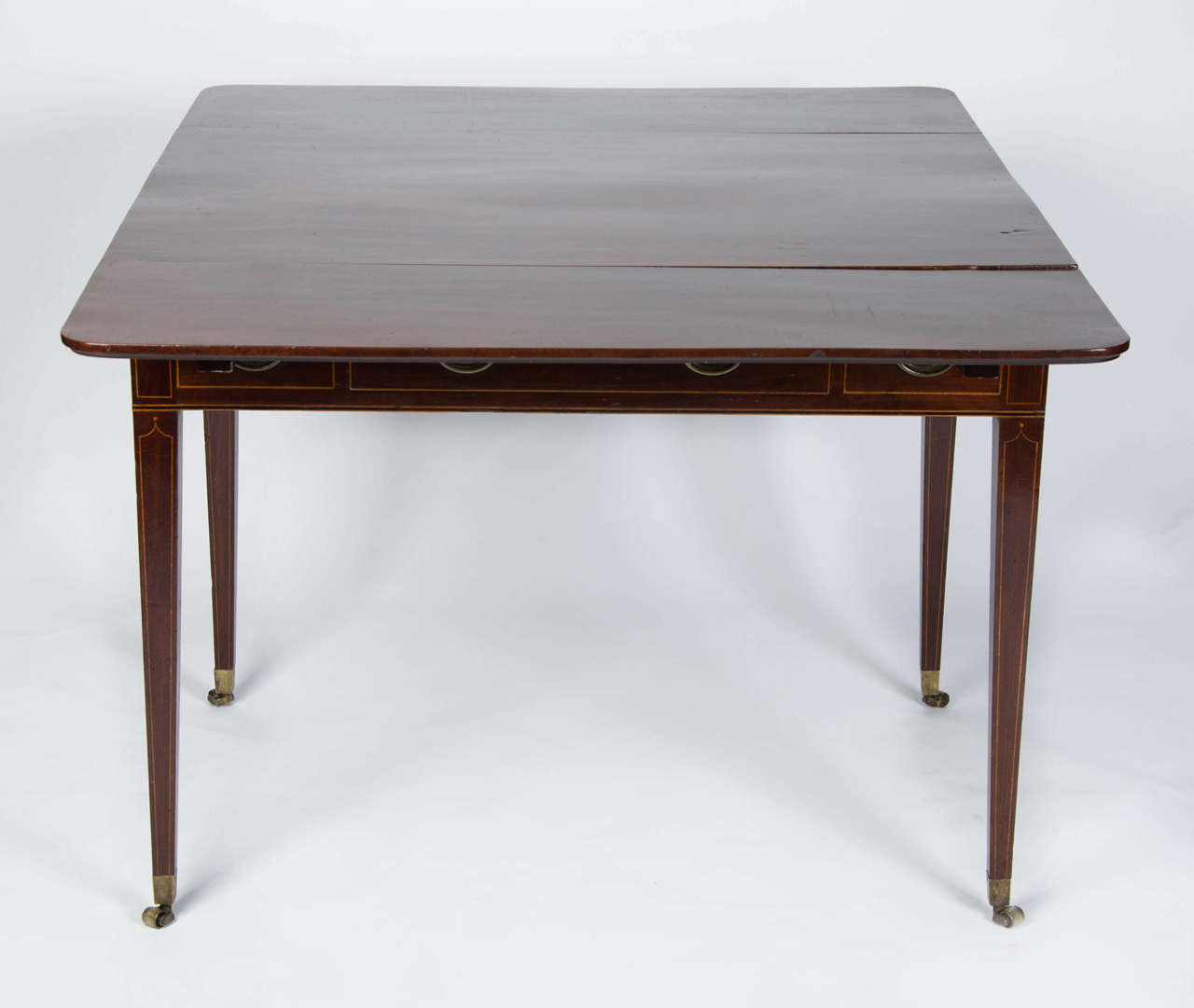 A fine and most useful late 18th century draw-leaf table similar to designs by Thomas Sheraton in his 'The cabinet-makers and upholsterer's drawing book'. 
The top concealing two-draw leaves with a single central fitted drawer.