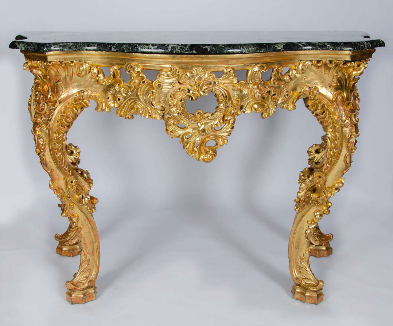 A stunning Rococo revival console table with green marble top.
Excellent, retaining all its original gilding.