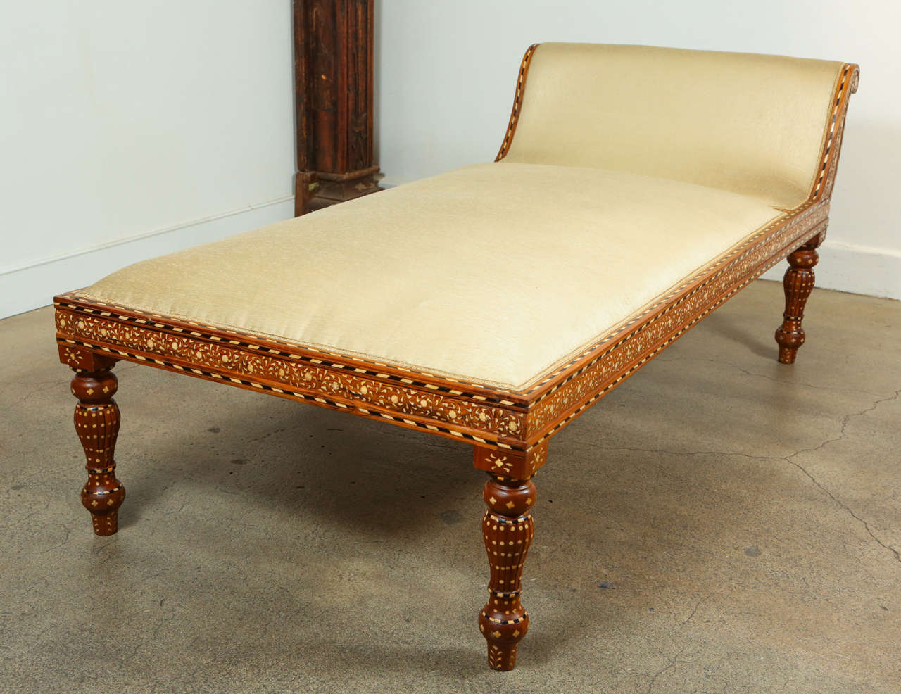 Large Anglo-Indian day bed, heavily inlaid with bone, turned legs, newly upholstered with ivory color silk fabric.
Egyptian Cleopatra style daybed with Moorish designs.