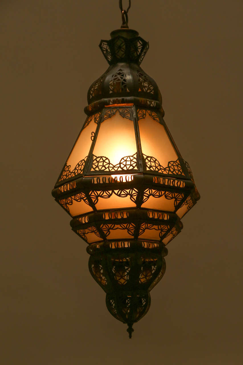 Vintage Moroccan Moorish lantern.
Elegant and stylish milky glass handcrafted Moroccan pendant with intricate filigree work in the Moorish style.
Will add elegance in any Hispano Moresque room.
Could be used as a wall sconces or hanging from the