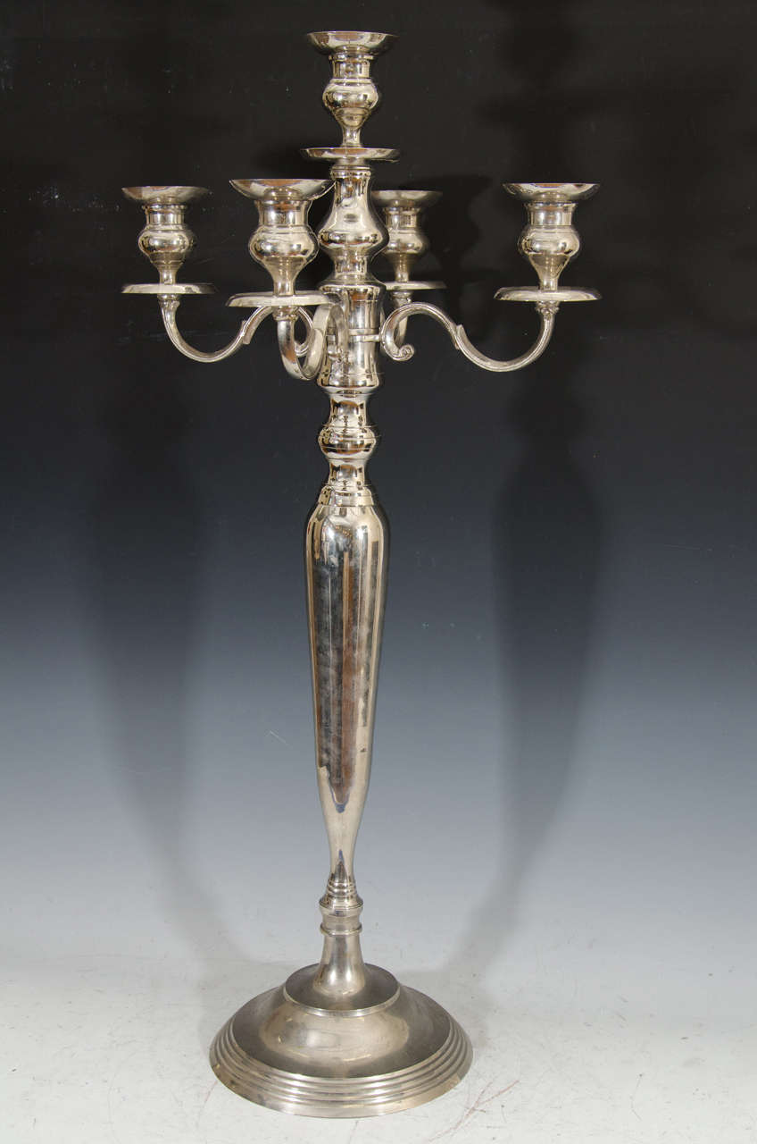 An early 20th century silver plate four arm candelabra with a fifth central light. 
Good condition with some loss of finish to one of the bobeches, and on the base.

Reduced from: $1,150.