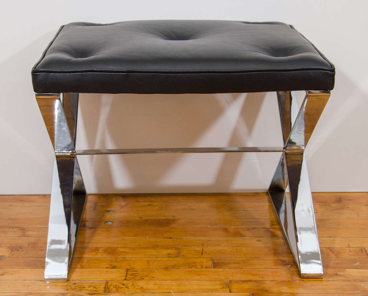 A vintage pair of Milo Baughman x-base chrome over steel benches with button tufted leather top. Newly re-upholstered.