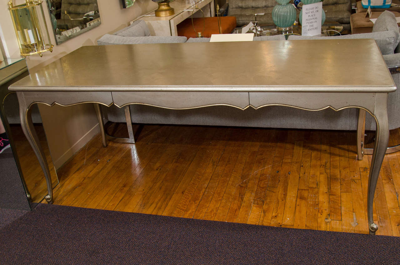A vintage 1950’s desk with silver textured paint and gold striping by J.B. Van Sciver Co. Desk retains its original label.

Reduced from: $1,850