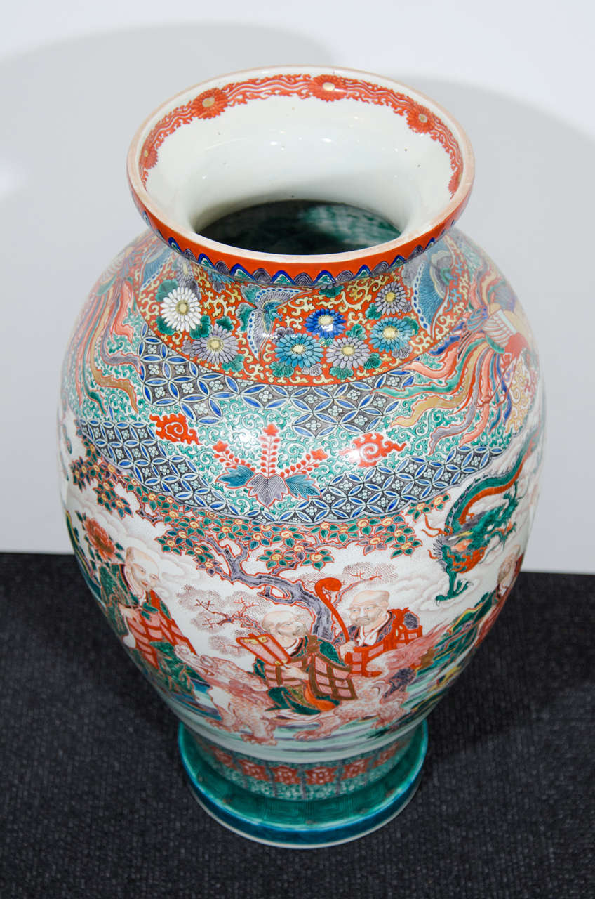 A 19th century colorful Japanese porcelain Kutani Vase decorated with figures and dragon.