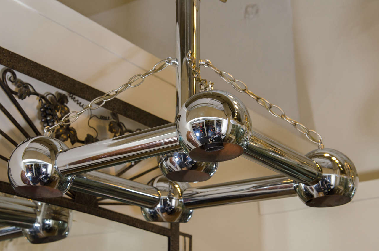 A vintage chrome tubular chandelier in the style of Gaetano Sciolari. In good vintage condition.