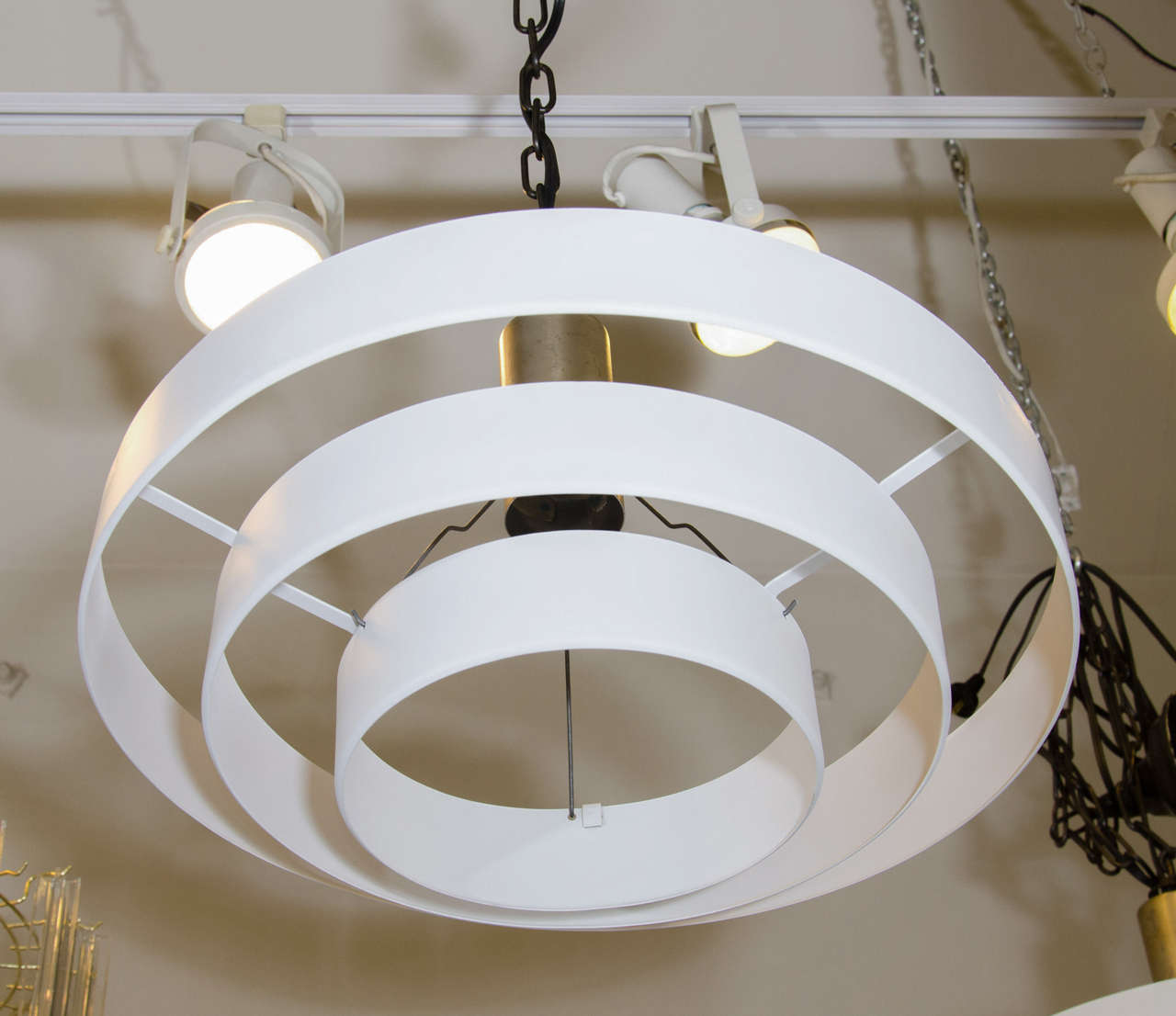 A vintage white enameled space age light fixture with three concentric layers or tiers. 

 Dimensions: 19