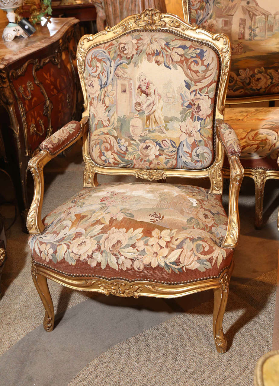 Five piece gilt wood Louis XV style salon suite
Floral carved frames
Late 19 th century with Aubusson  tapestry depicting scenes from 
La Fontaine's fables 

This is an impressive suite consisting of a large
Canape' and four generous size