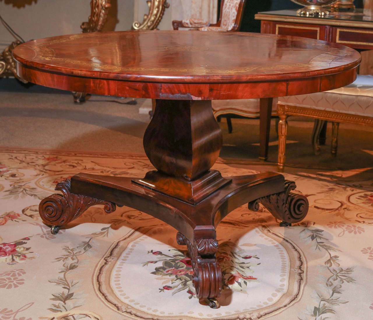Circular center table
Flame mahogany
Tilt top
Fan shaped veneers in a beautiful pattern
Decorated with gilt stenciled designs