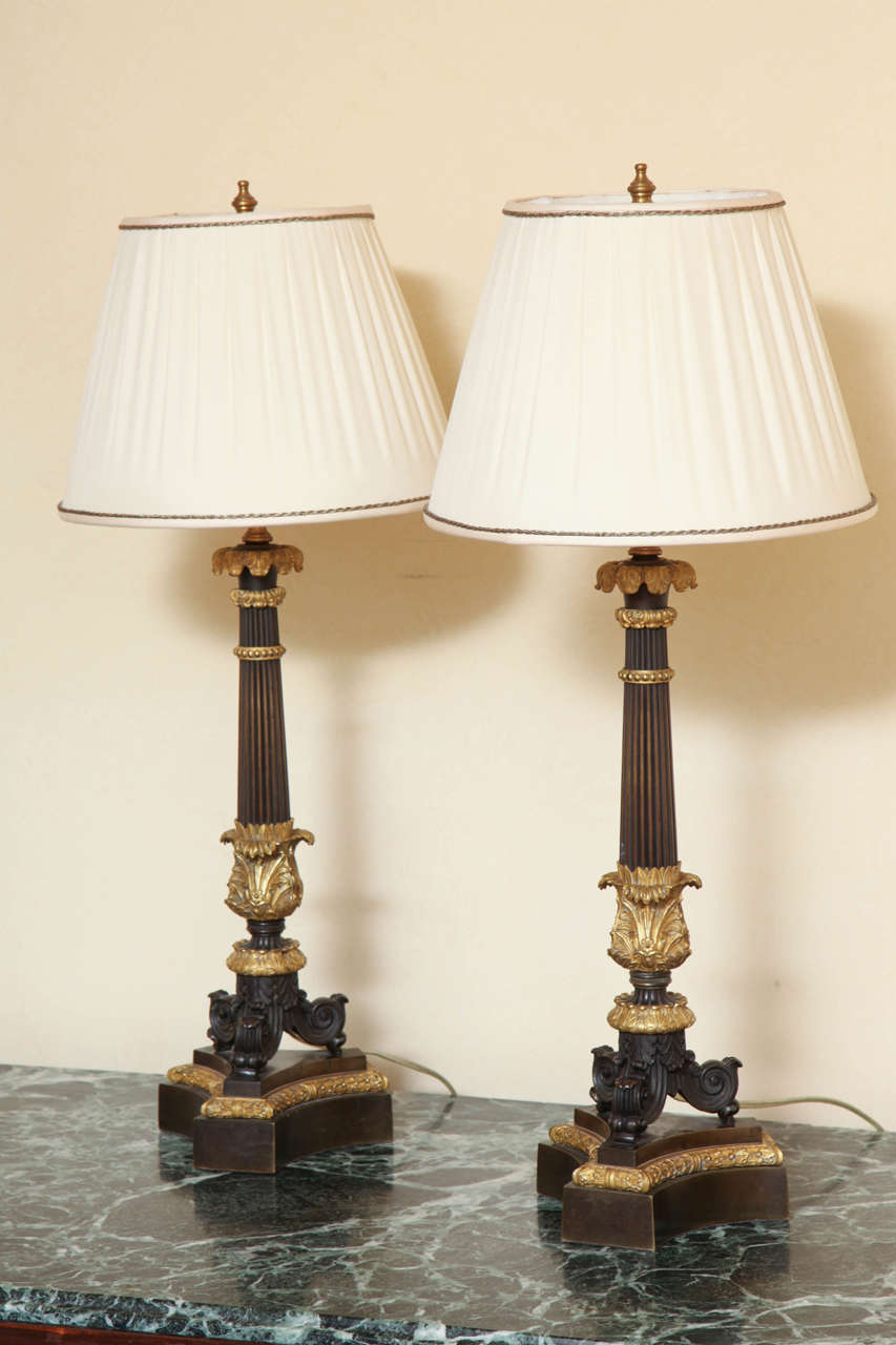 With acanthus-wrapped fluted columns on scroll-form feet and triangular base. Lamp shades not included. Height to socket is 20