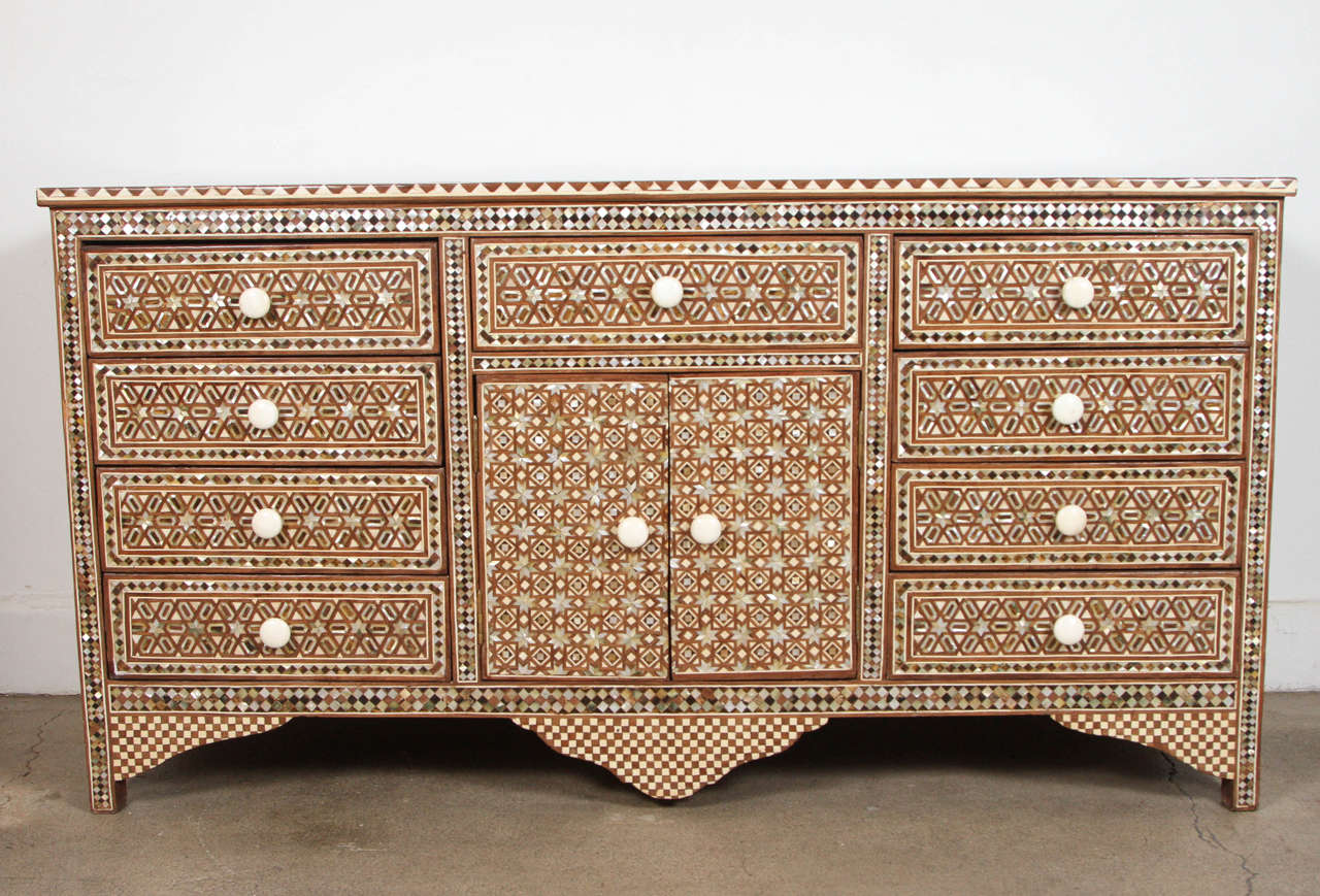 Fabulous large Syrian mother-of-pearl inlay, bone and tortoise chest of drawers.
Sideboard buffet with 4 drawers on each side and one drawer and two doors in the middle.
Fabulous intricate Moorish Middle eastern geometric inlay designs with bone