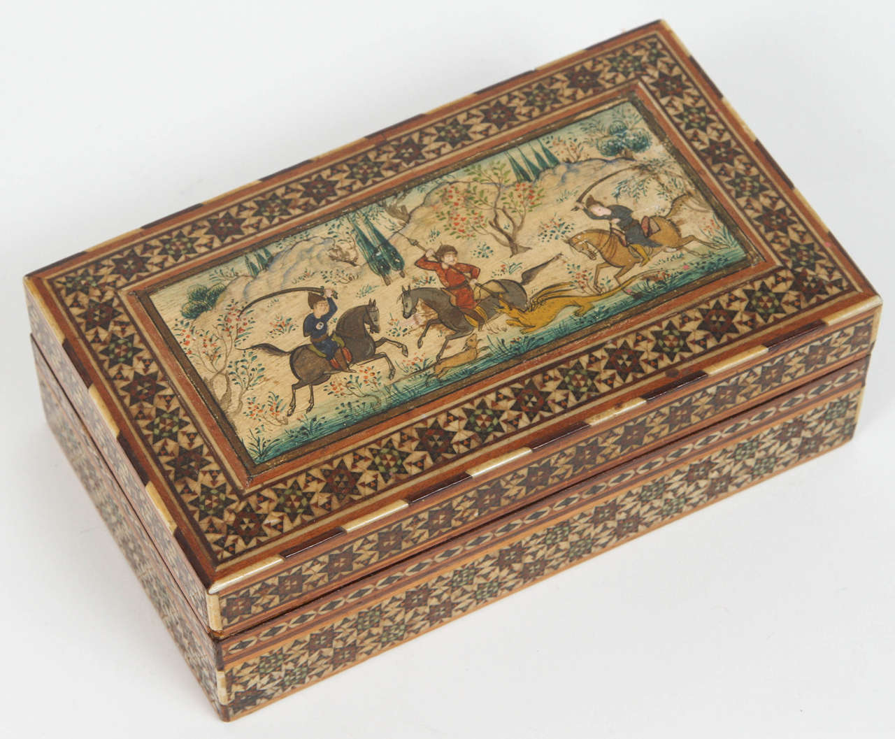 Fine Antique handcrafted box micro mosaic inlaid in geometric design and with a scene of 3 Iranian men on horses hunting.
This Middle Eastern Persian inlay boxes were used to store cigarettes, or cards.
Museum quality piece like the ones in Doris