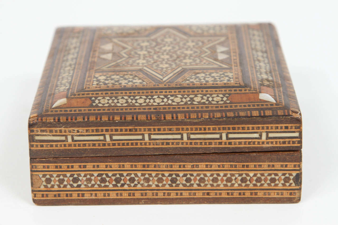 Antique Islamic Persian inlay micro mosaic box.
Middle Eastern inlay with mother-of-pearl and Syrian marquetry with geometric Moorish designs.