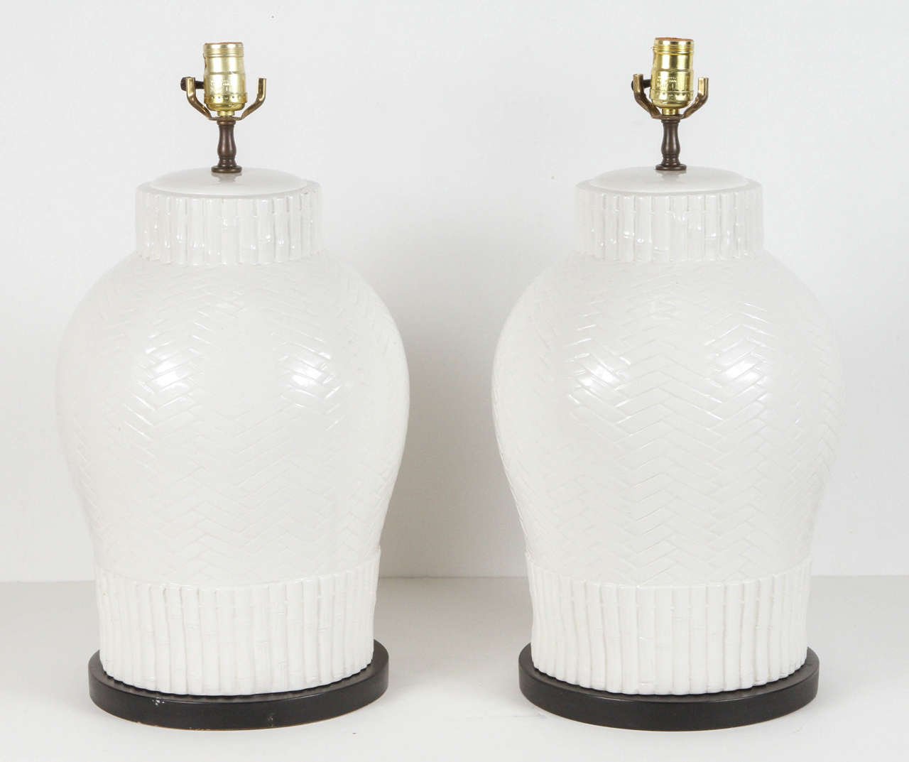 Pair of large white French Chinese style textured porcelain table lamps.
1930s French "chinoiserie" style, porcelain textured with bamboo design.