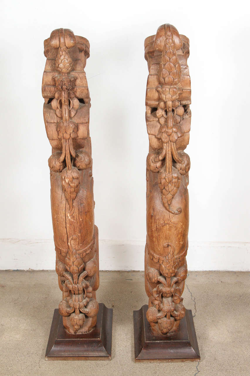 Pair of tall Antique architectural carved wood temple truss fragments from India on stand.
Wooden hand-carved fragments architectural truss temple, large and heavy.
Measures: Wooden stand is 13