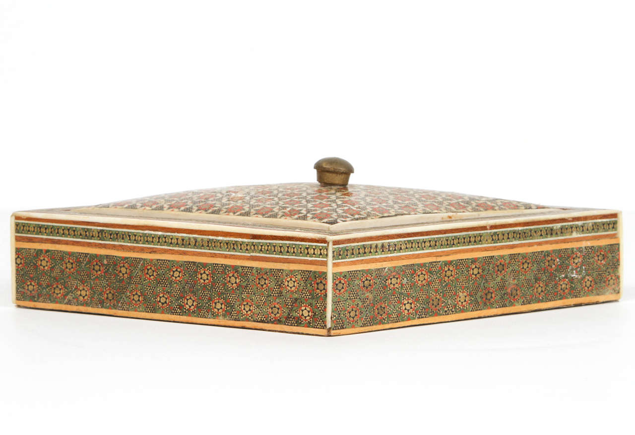 Anglo-Indian micro mosaic inlaid jewelry box with lid.
Intricate inlaid British colonial box with floral and geometric Islamic design in a lozenge form.
Anglo Raj Colonial bone inlay and marquetry, very fine artwork.
Museum piece like the one in