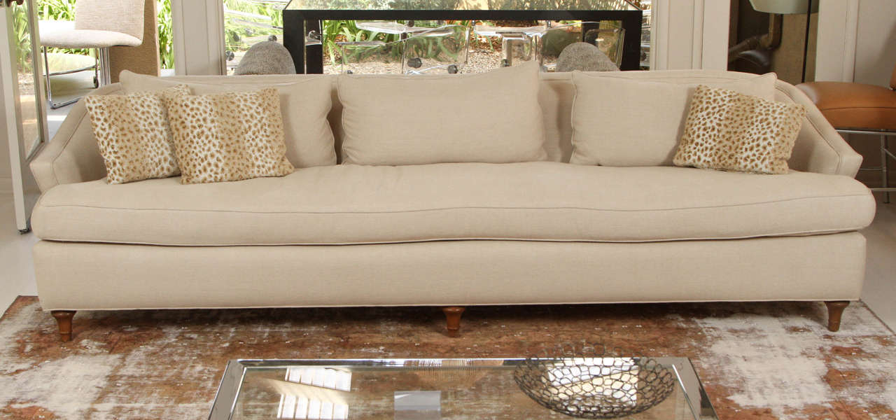 The sofa bases are vintage, but the cushions and reupholstery new. The lines are sophisticated and elegant. They are stunning facing each other in a room, or could be purchased separately. The soft linen color makes them more accessible and casual,