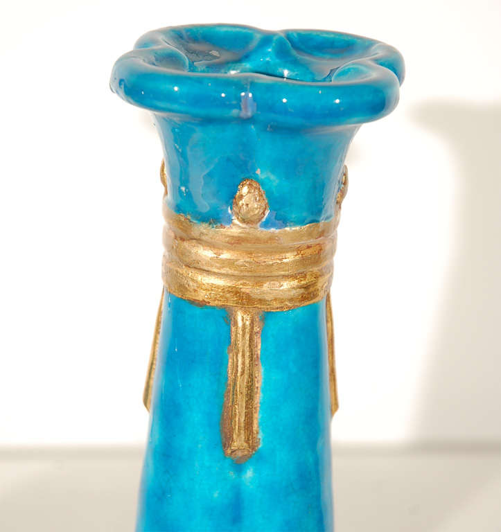 Set of four candlesticks in a brilliant Persian turquoise with gold glaze accents by Leon Volkmar for Durant Kilns. Be sure to see our companion Durant Kilns pieces. 

Begun in 1910 by Jean Rice, the Durant Kilns in Bedford Village, New York