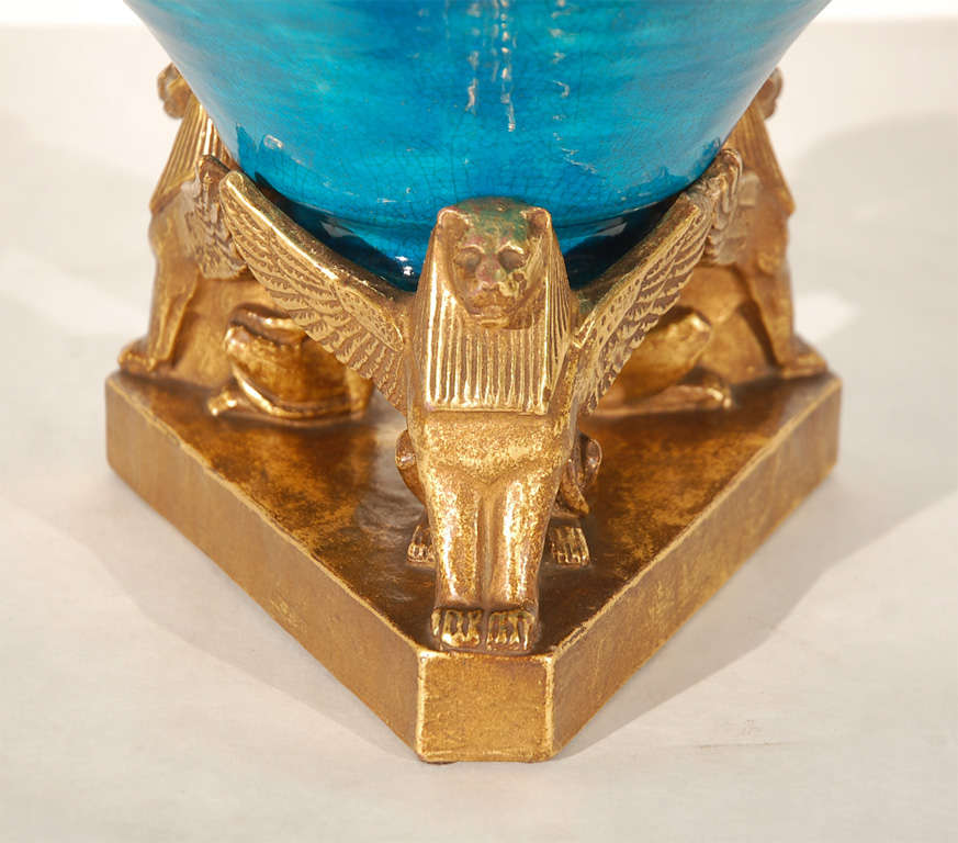 Spectacular bowl and figural pedestal comprised of a Persian turquoise glazed bowl and gold glazed winged lion base by Leon Volkmar for Durant Kilns. Be sure to see our other companion Durant Kilns pieces.

Begun in 1910 by Jean Rice, the Durant