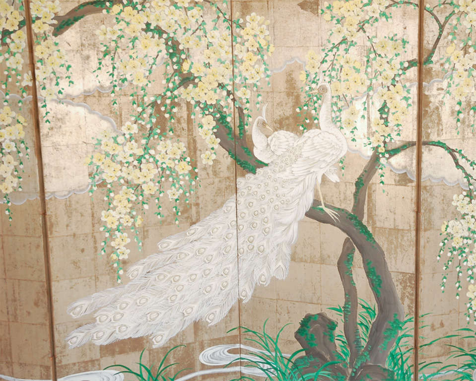 A beautiful hand-painted folding screen featuring a pair of white peacocks perched in a yellow cherry blossom tree, executed on tea paper, signed Robert Crowder (see Image 5). The four panels measure six feet in height, and approx. 24