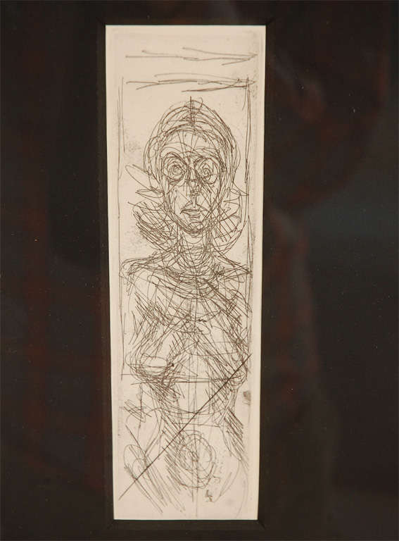 An unsigned lithograph by Alberto Giacometti matted in black and in a gilt frame. The lithograph itself measures 8