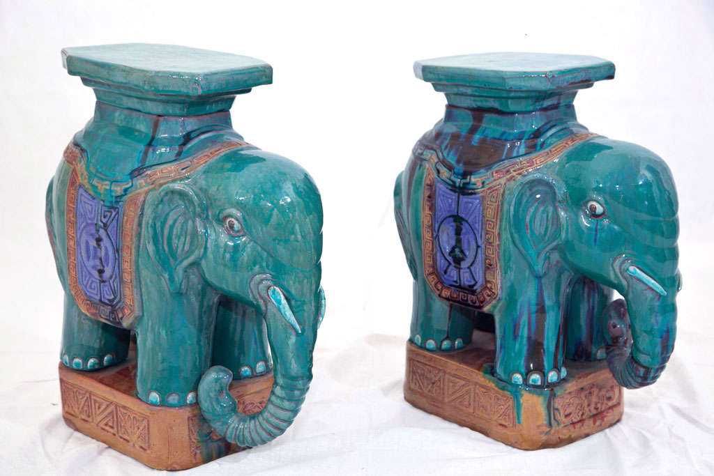 Pair of lovely, green garden stools with Elephant theme. All original paint