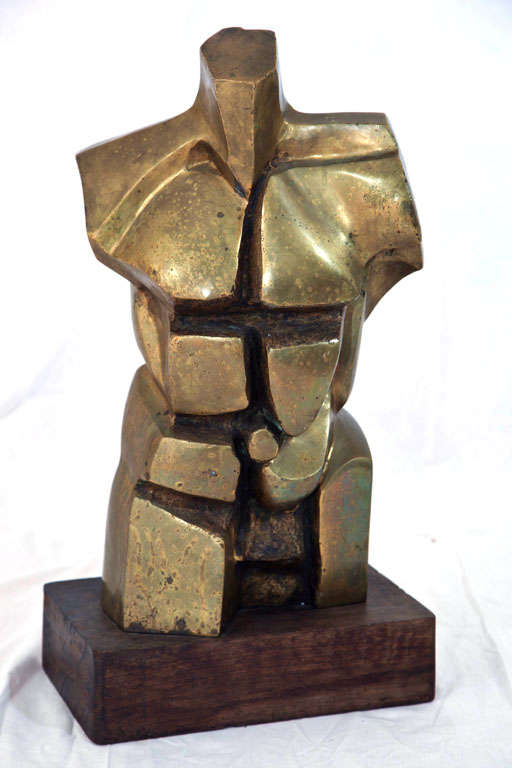 Amazing, heavy bronze male sculpture in the style of Miguel Berrocal. Illegibly signed. Super heavy and well executed. Wood base. Very well-balanced. A terrific accent piece with great presence.