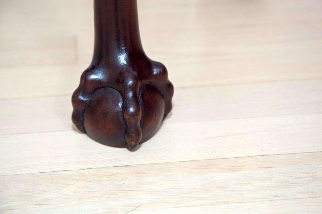 antique game table with claw feet