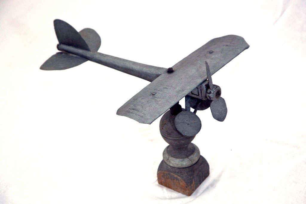Aluminum weather vane.  Movable propeller. Plane spins to different positions on stand.