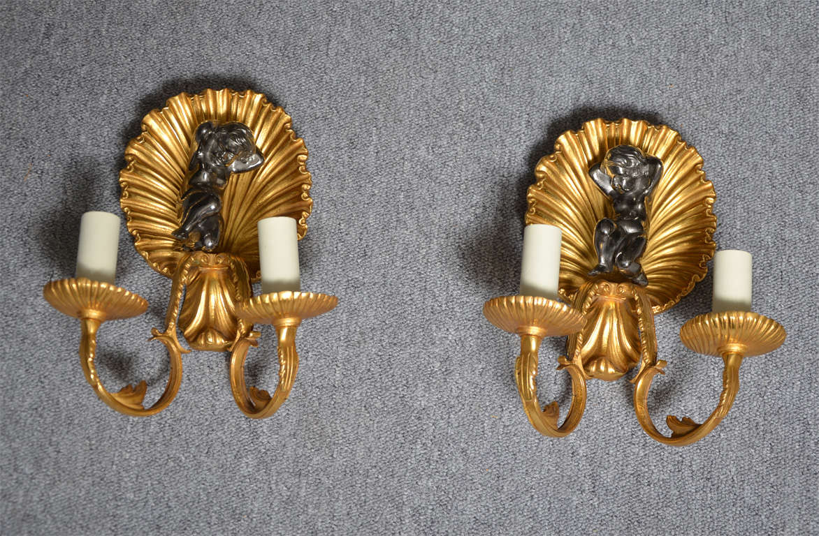 Pair of double arms sconces showing a 