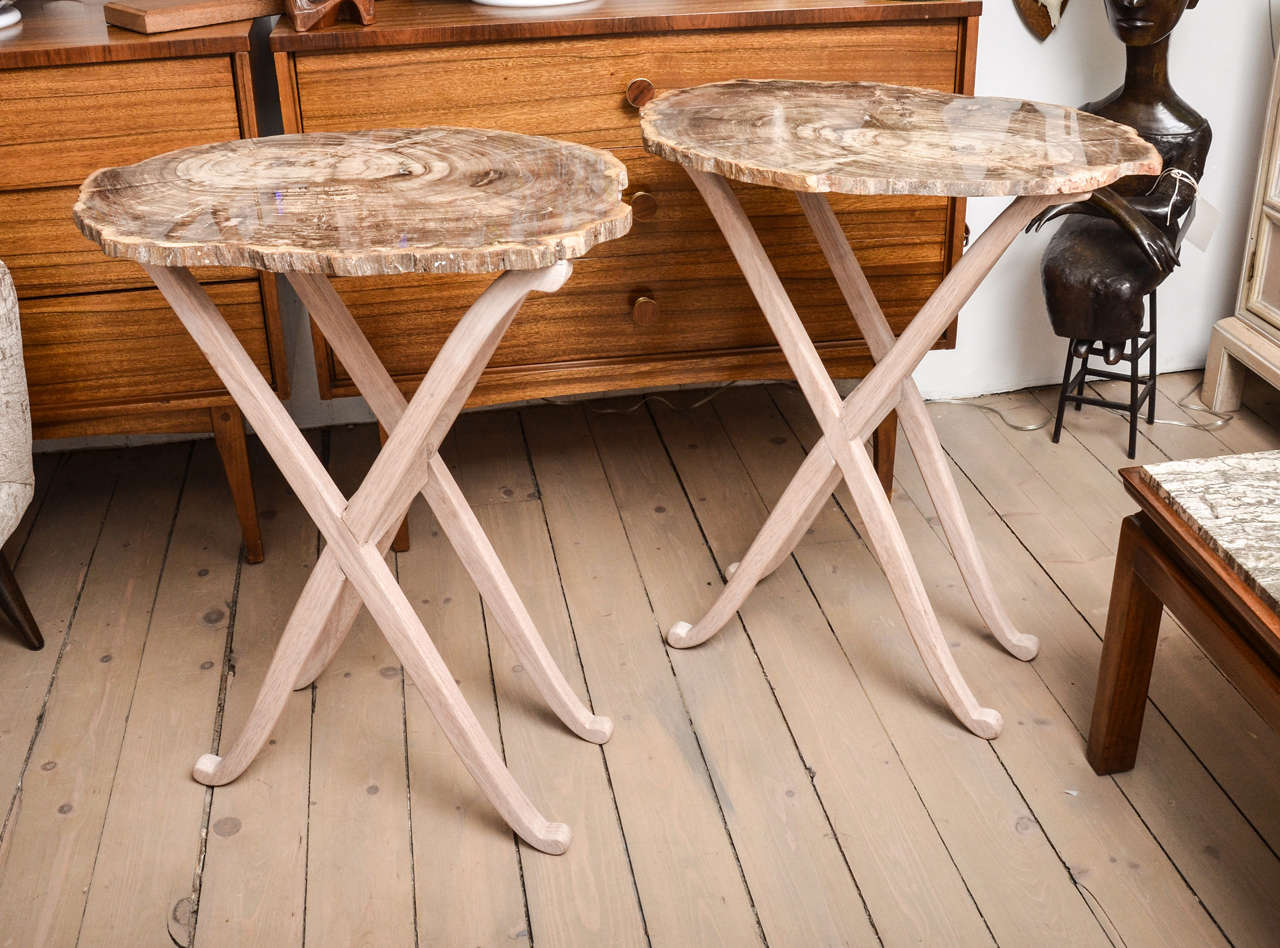 Single Petrified wood table on wood base.  Originally a pair, one sold.