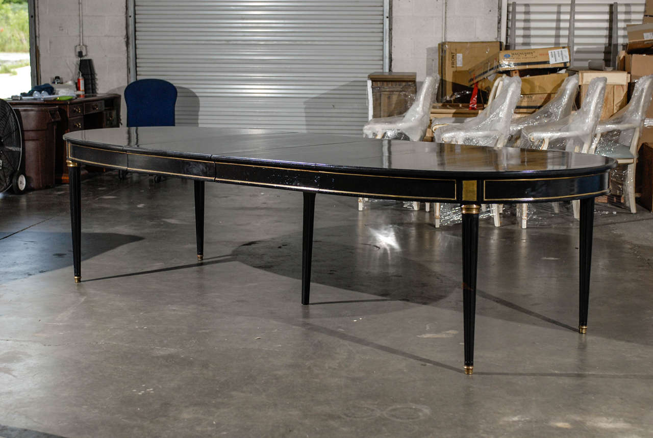 20thC LOUIS XVI STYLE EBONIZED DINING TABLE,TWO LEAVES, LACQUERED BLACK: ( APRON 25.75