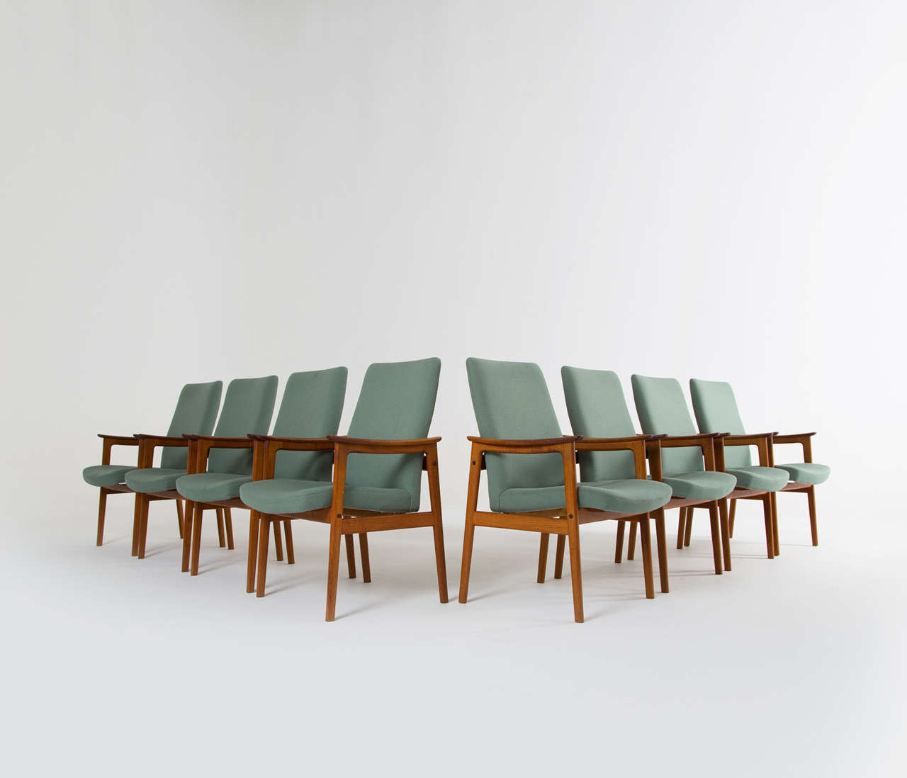 Set of eight danish dining chairs with a solid teak base
and original pastel green upholstery.

Worldwide shipping possibilities;
For competitive delivery quotes and a variety of delivery options and services, ask our in-house shipping