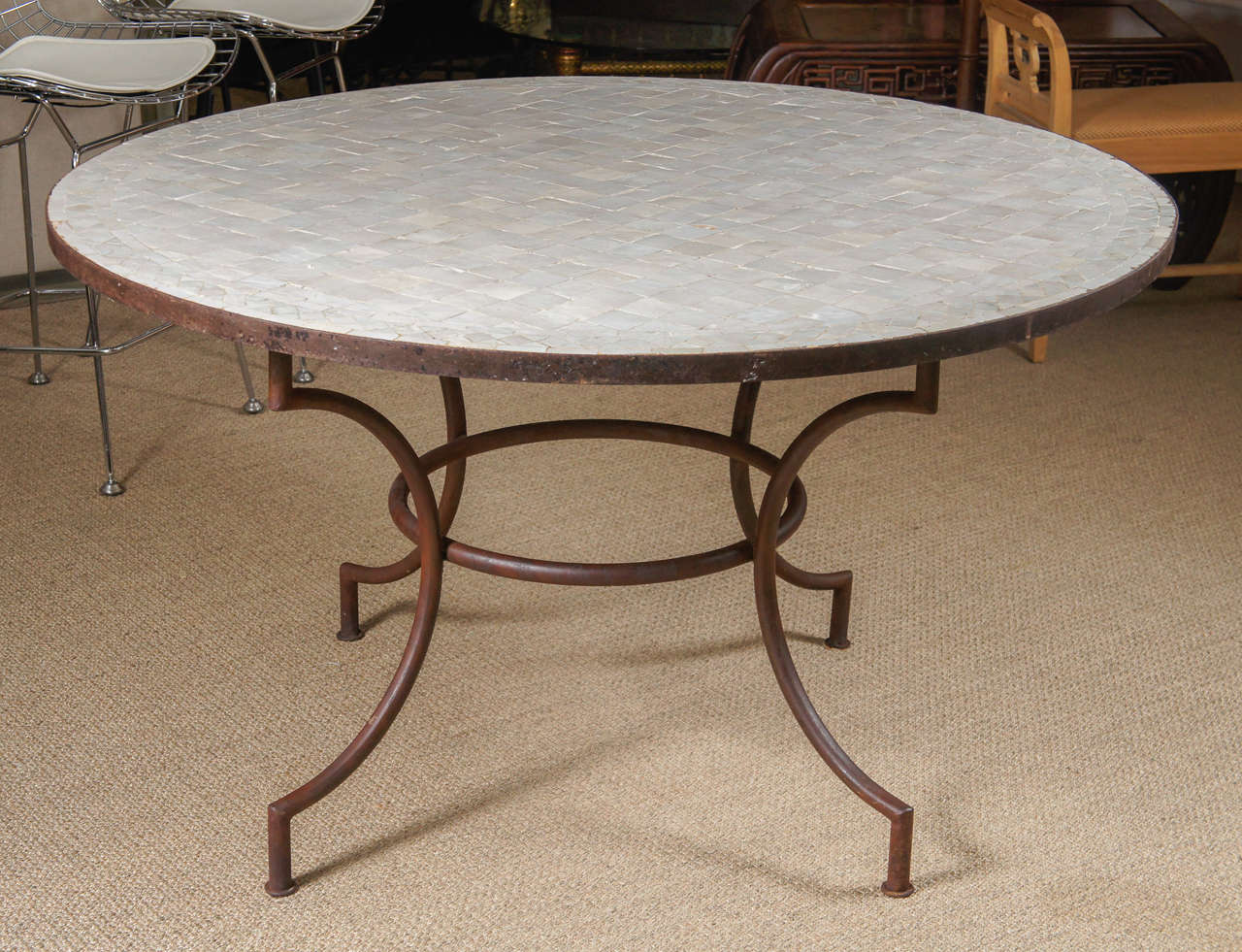 Here is a great mosaic tile top table with an iron base.