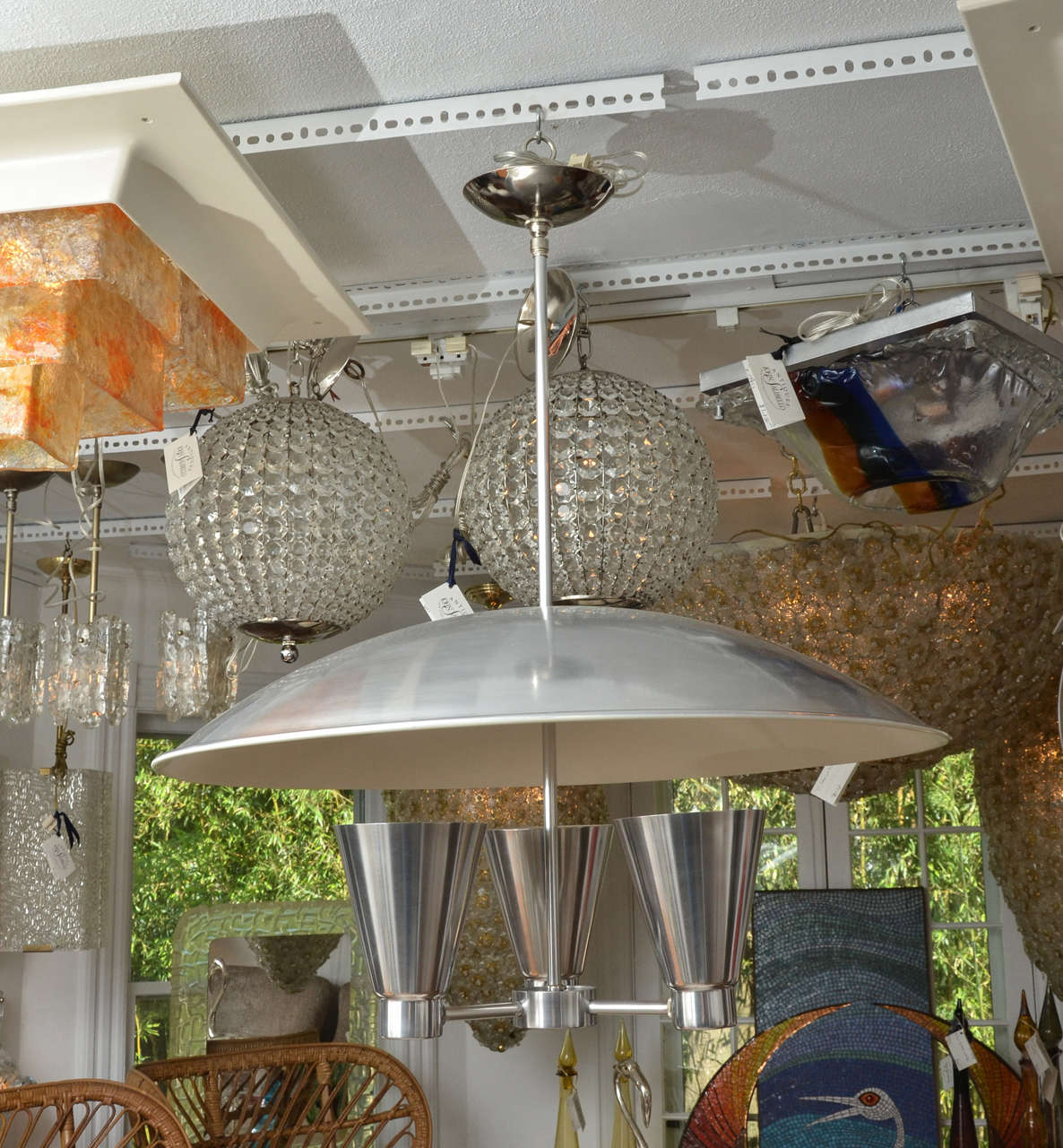Spun aluminium dome ceiling fixture with three conical uplights by Edward Wormley.
Three standard bulbs.