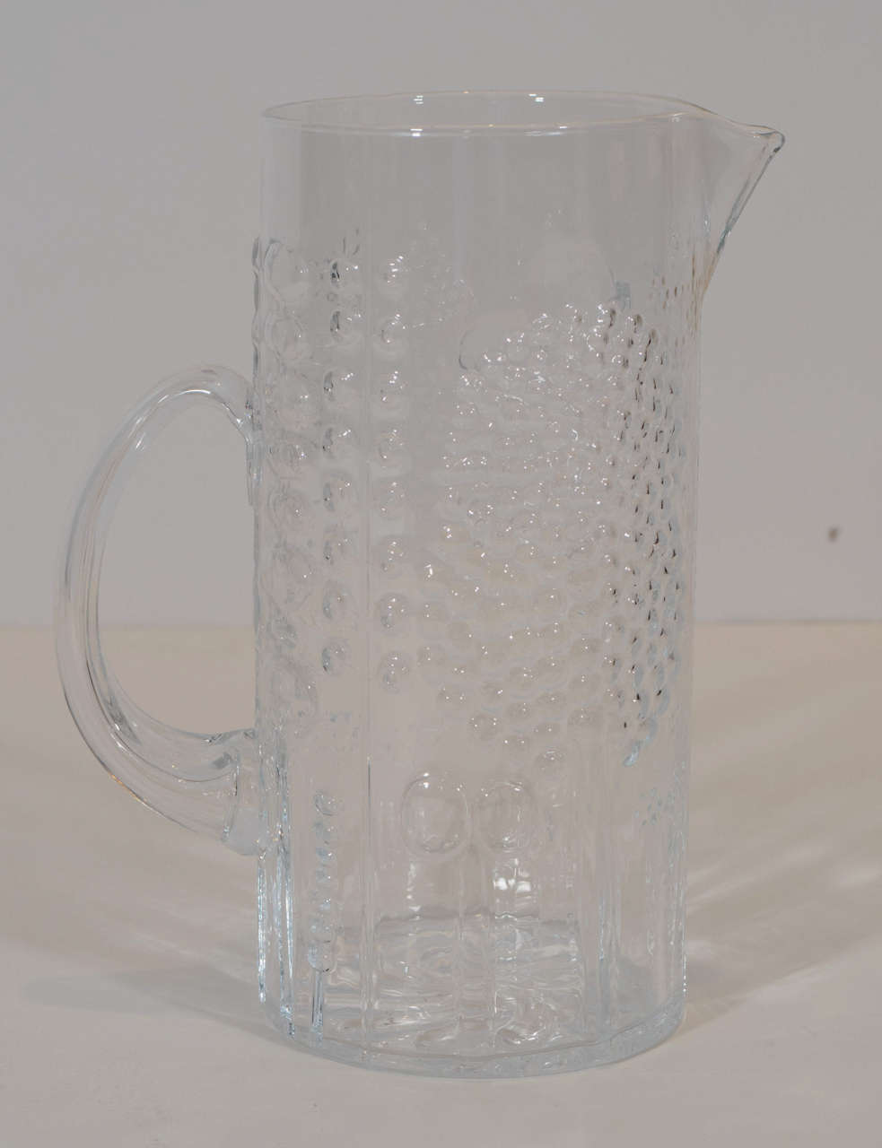 Beautiful crystal pitcher in the Flora series by Oiva Toikka. Also available: a set of six matching drinking glasses. Please contact for location.