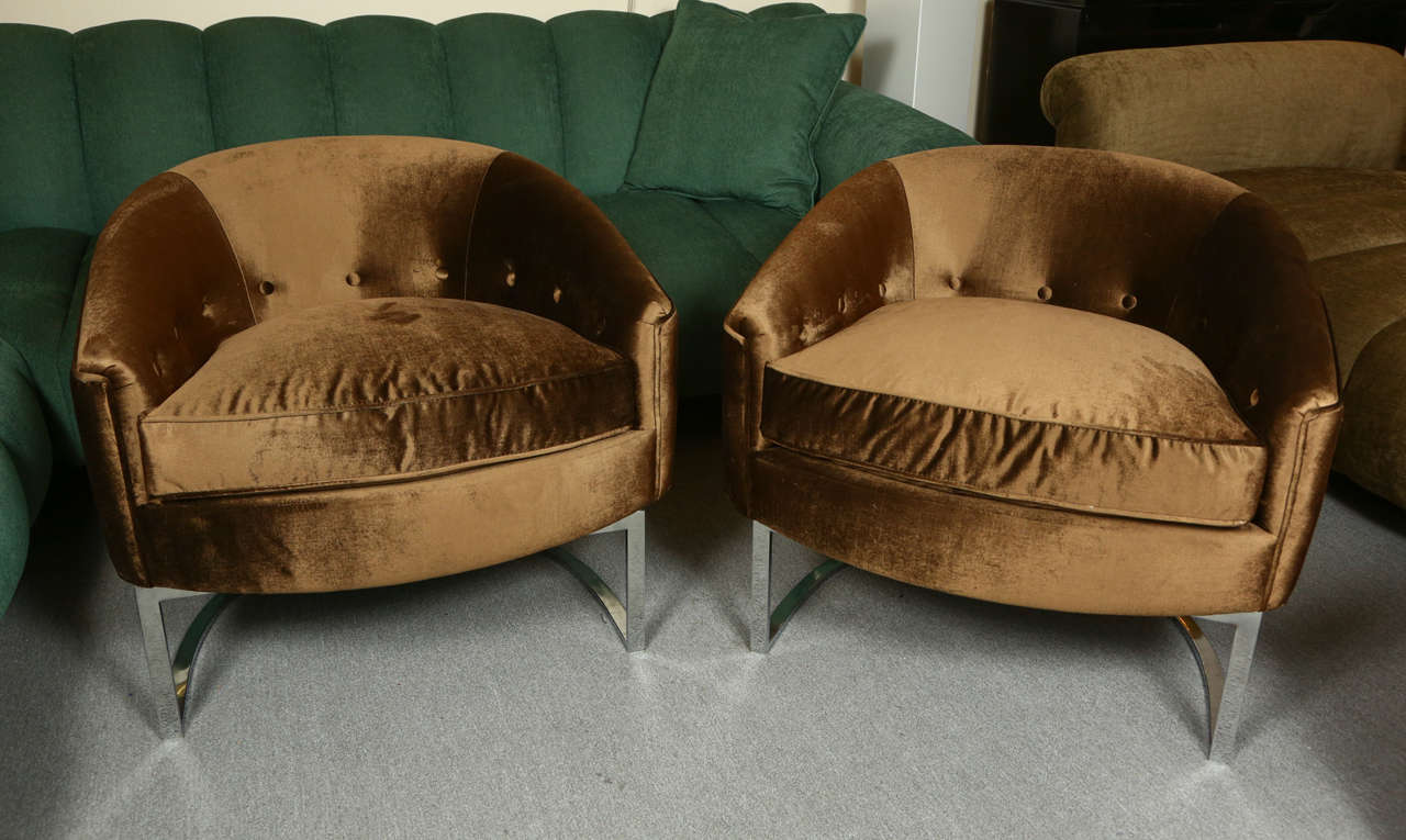 Pair of elegant club chairs by Milo Baughman
The chairs have been newly reupholstered in a chocolate brown silk velvet and have separate down cushions. The chairs sit on polished chrome bases.