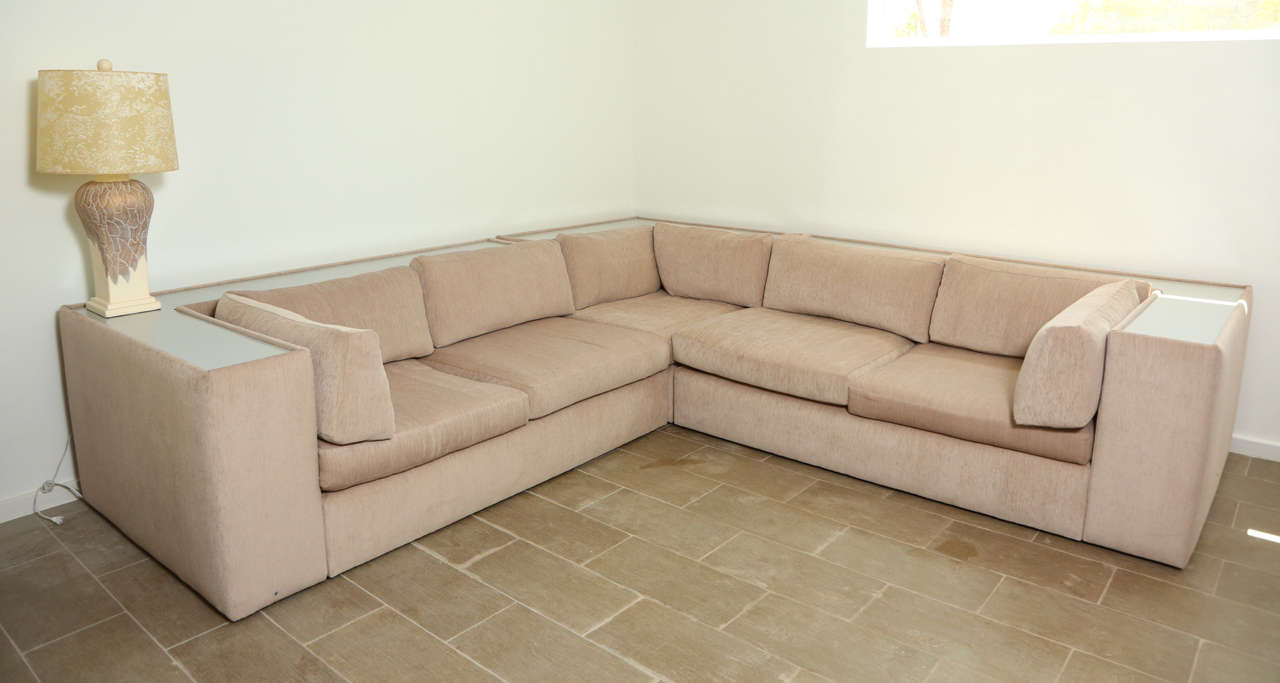 Wonderful 3 piece sectional sofa by Milo Baughman
The sofa has been newly upholstered in a taupe fabric and has separate seat and back cushions. The sofa is 118
