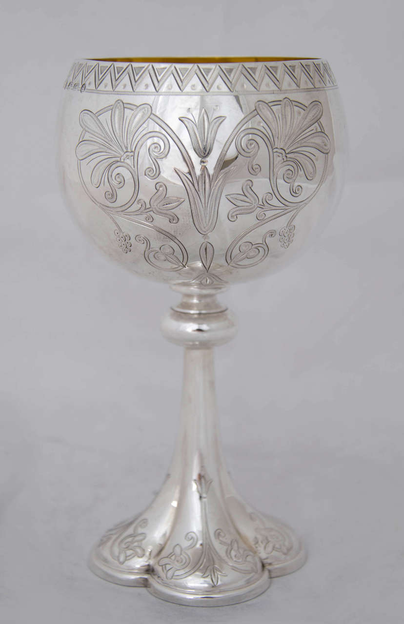 Four Antique Sterling Silver Goblets made by the prestigious firm of Frederick Elkington. The goblets were hallmarked in Birmingham between 1873,and 1876 and are exquisite examples of the Gothic Revival style popular at the time.
Each goblet is