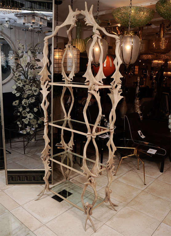 Four tier etagere composed of faux antlers with glass shelves by Arthur Court.<br />
<br />
View our complete collection at www.johnsalibello.com