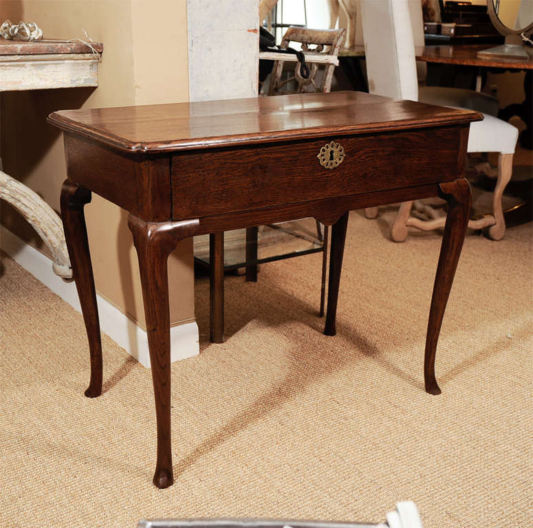 Oak side table with single frieze drawer on cabriole legs