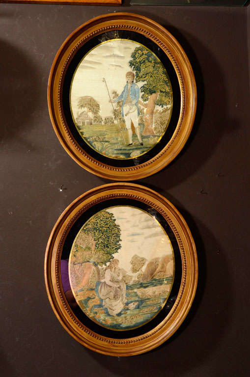 A pair of English  silk needlework embroidery and watercolor pictures: the first depicting a young girl deep in thought under a tree, the second depicting a finely dressed gentleman walking in a field. 
 Both worked in floss silks, and hand-drawn