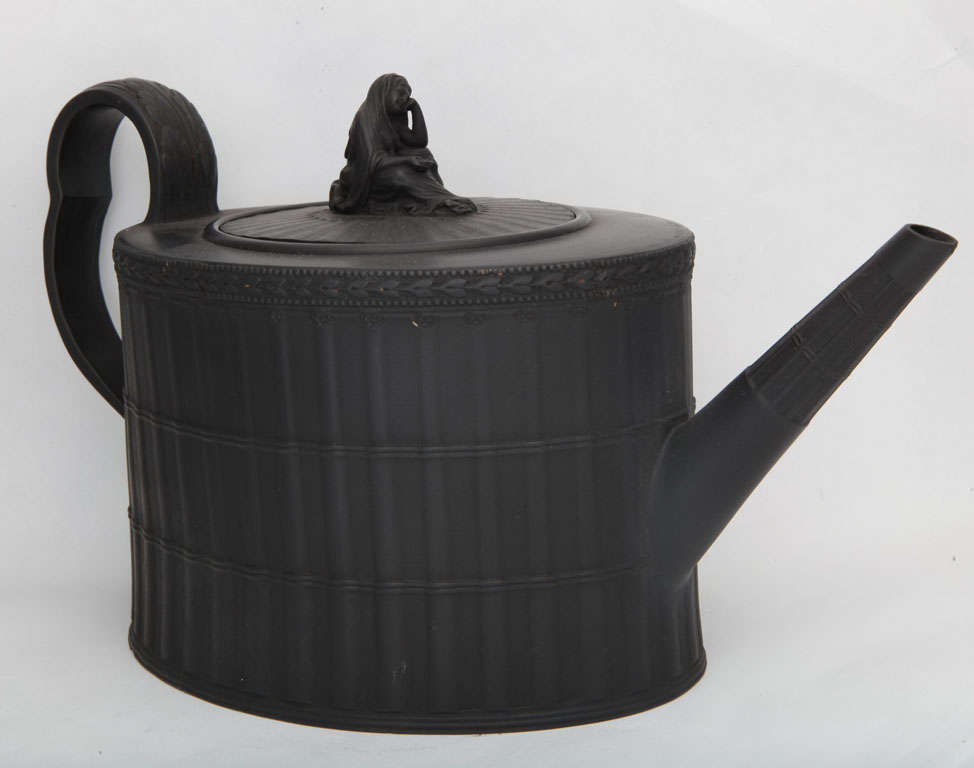A fine signed Neale & Co basalt teapot molded in a bamboo pattern