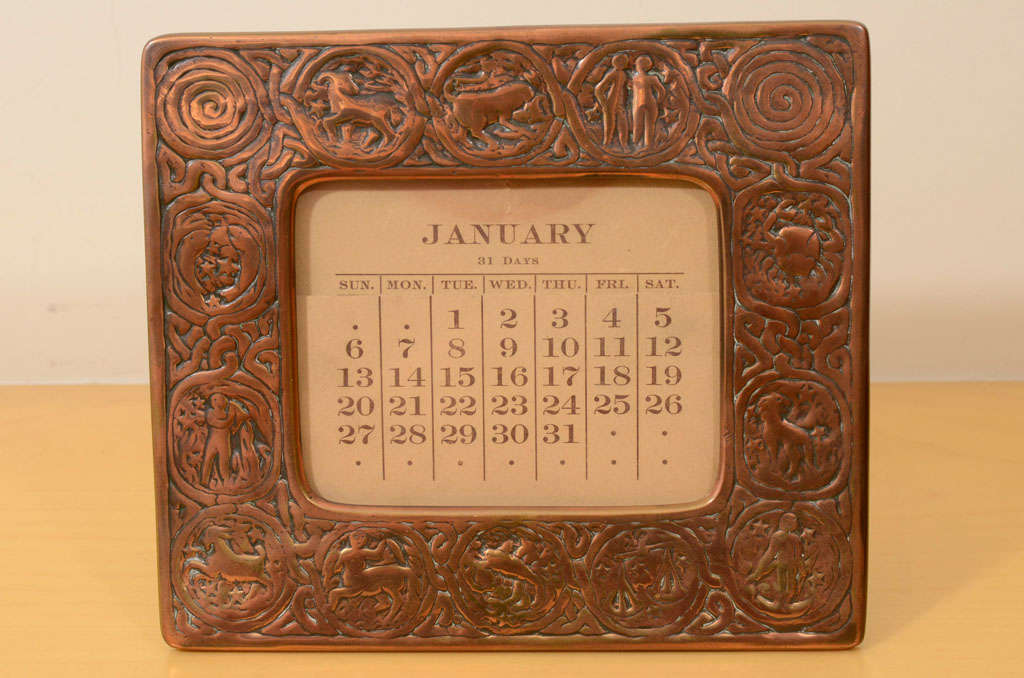 Tiffany Studios Calendar Frame, Zodiac Design with original calendar, signed Tiffany Studios, N.Y. 943, easel back
opening for calendar or photo measures 4