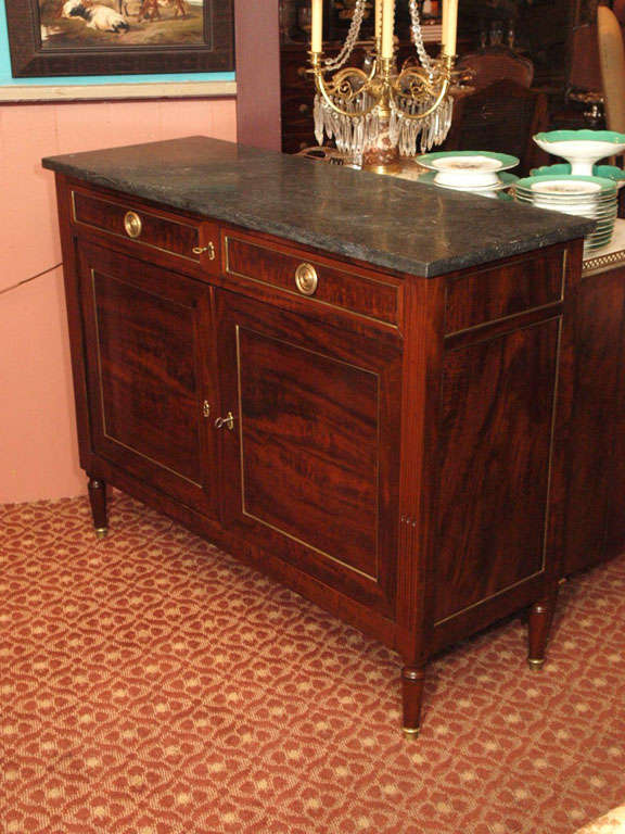 Early 19th century French mahogany buffet in the Louis XVI taste, with bronze filet decoration and dark grey marble top