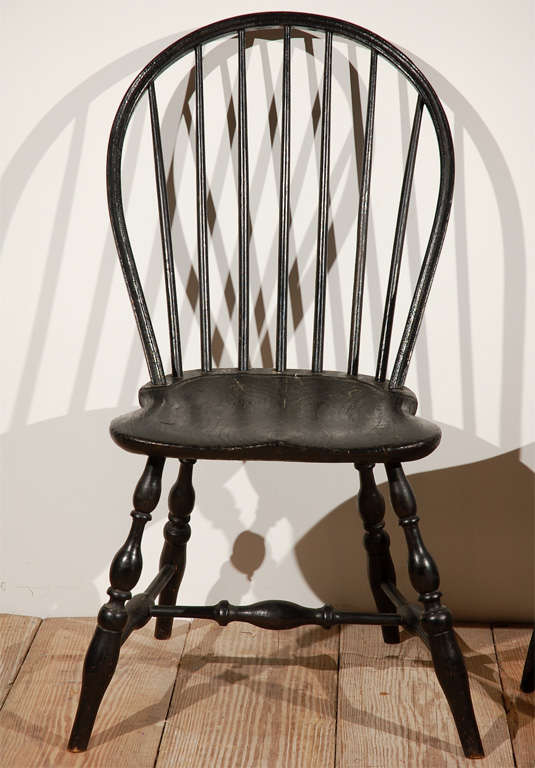 Black painted Windsor chair, sold individually. Carved spindle  leg chair is available.