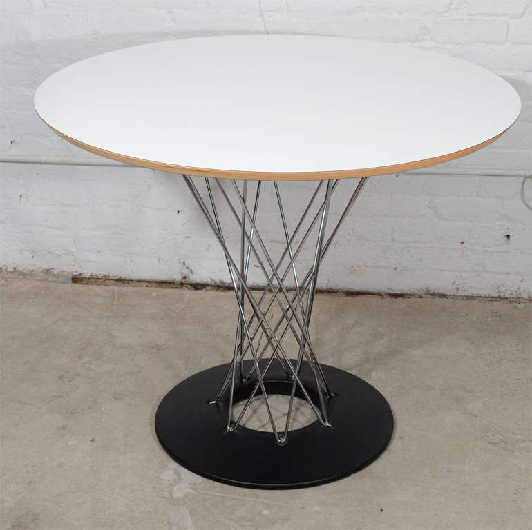 Nagouchi Cyclone table-36″, mfg Knoll.  Originally designed in 1953.  Available with or without 4 Bertoia chrome side chairs with red seat covers.