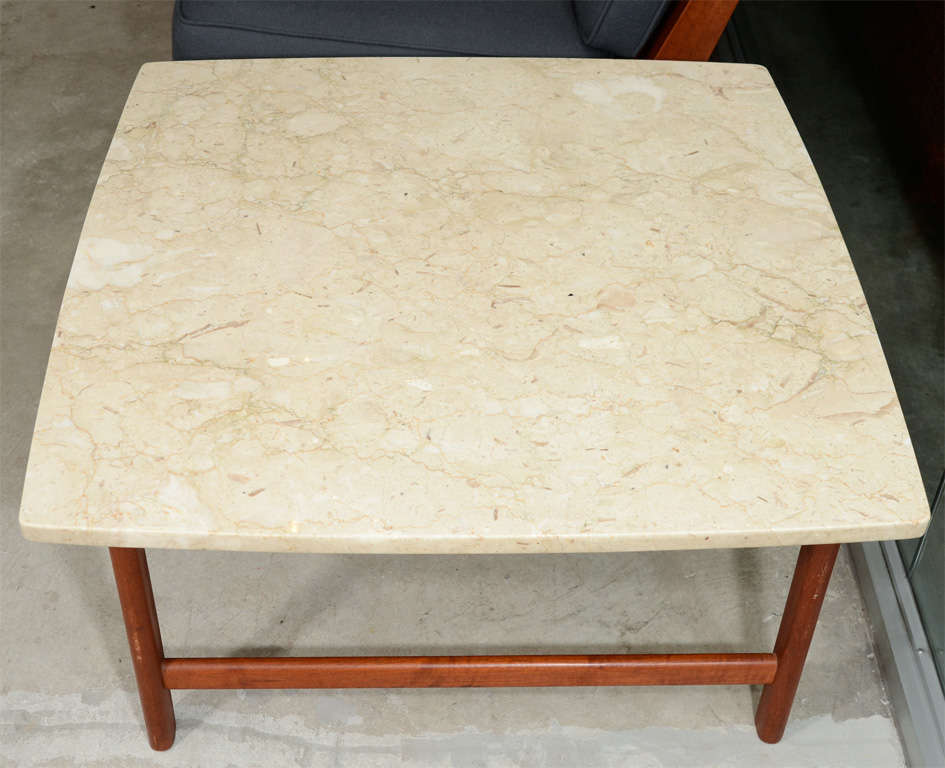 20th Century Solid teak coffee table with travertine top, mfg. Dux