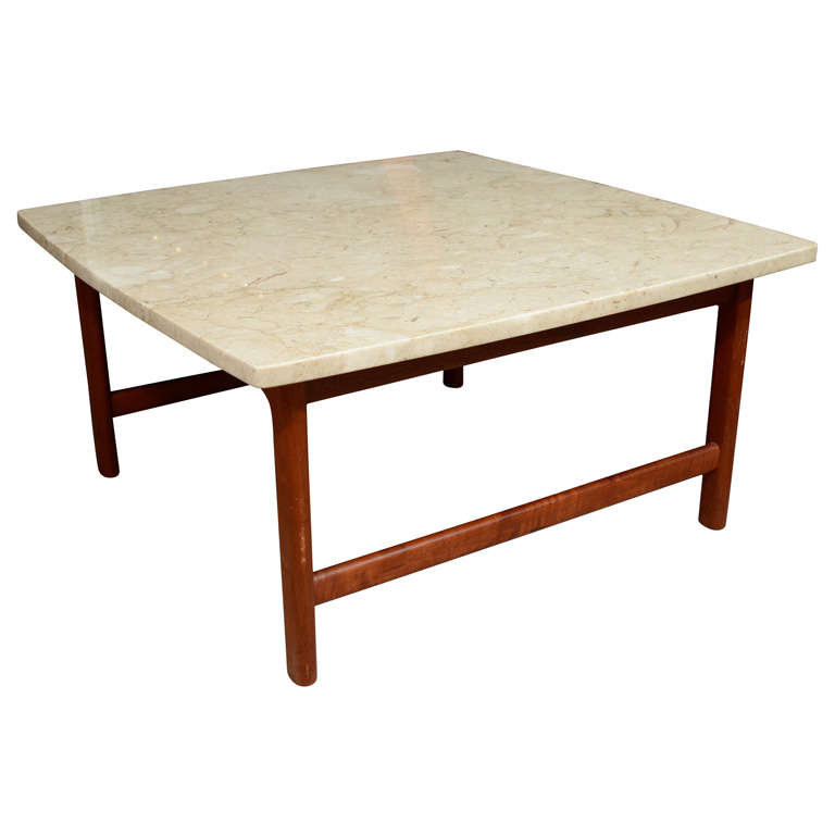 Solid teak coffee table with travertine top, mfg. Dux