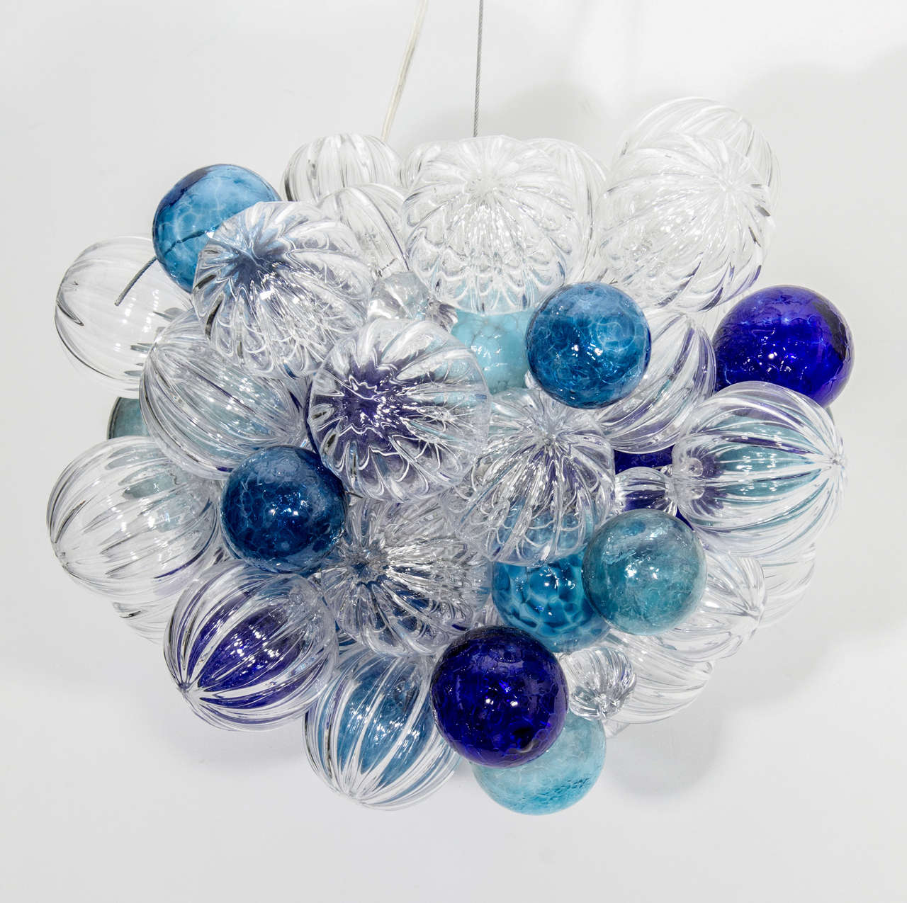 Handblown glass chandelier with glass balls of varying sizes and colors.