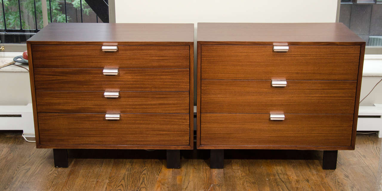 Two George Nelson walnut dressers with J pulls, mfg. Herman Miller.  One is a 4 drawer and the other has 3.  There is a tall dresser available separately.